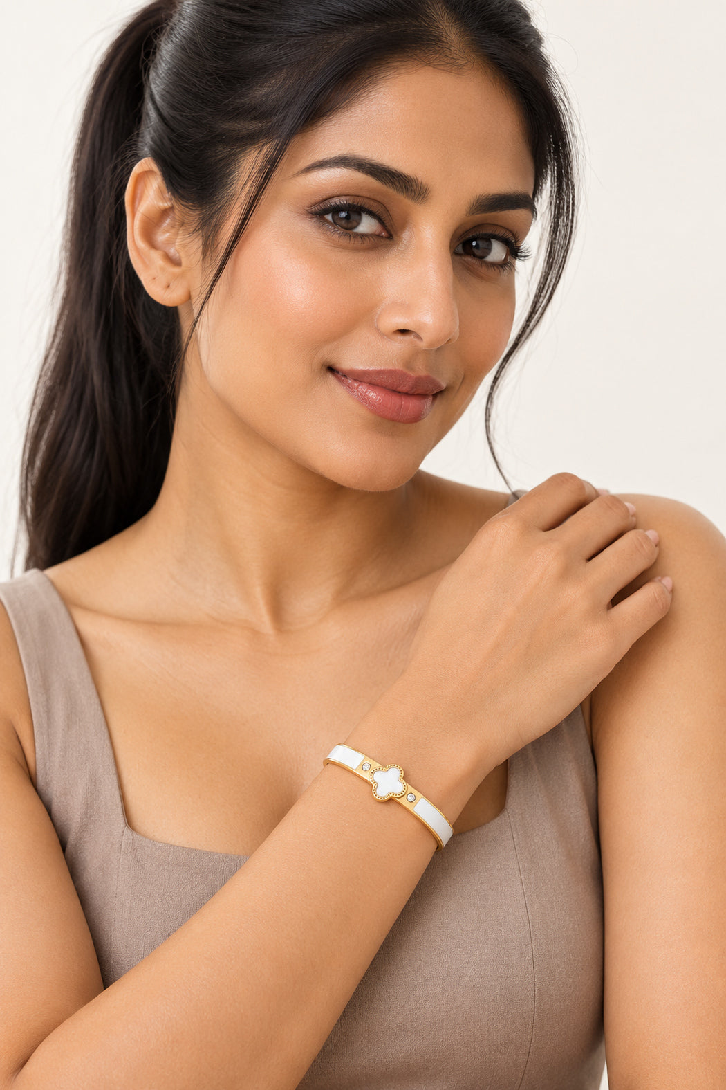 Enamel clover bangle bracelet with white clover motif and hinged cuff