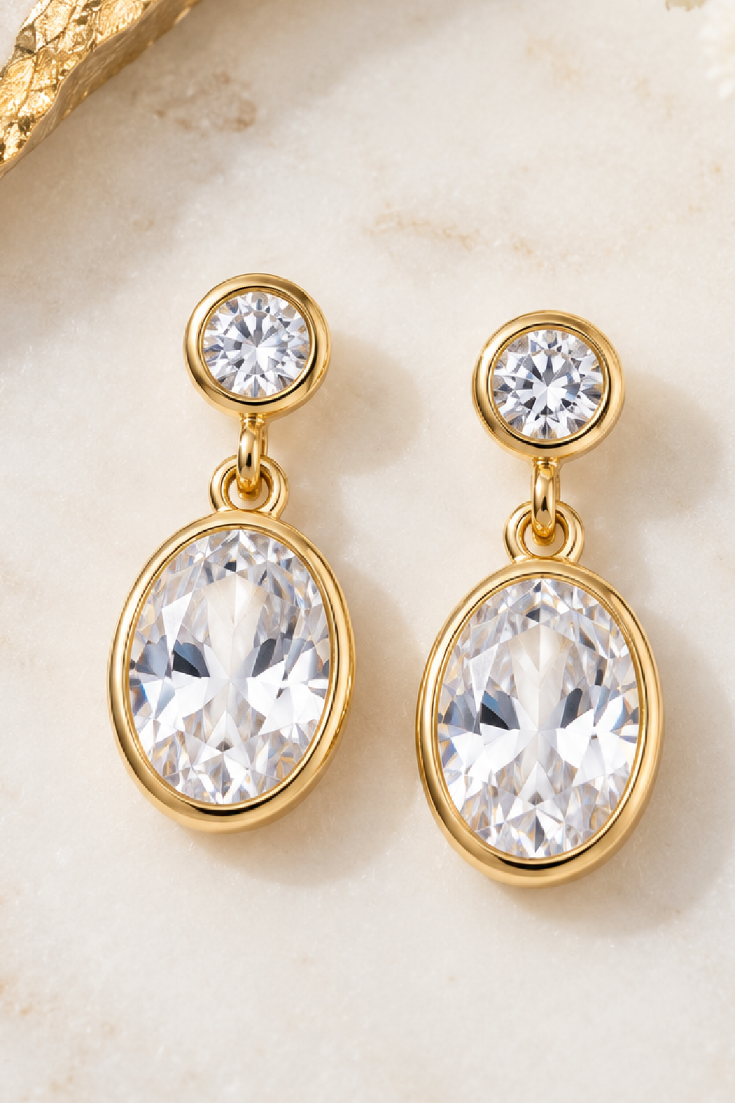 Gold oval CZ drop earrings with round stud and larger oval dangling crystal