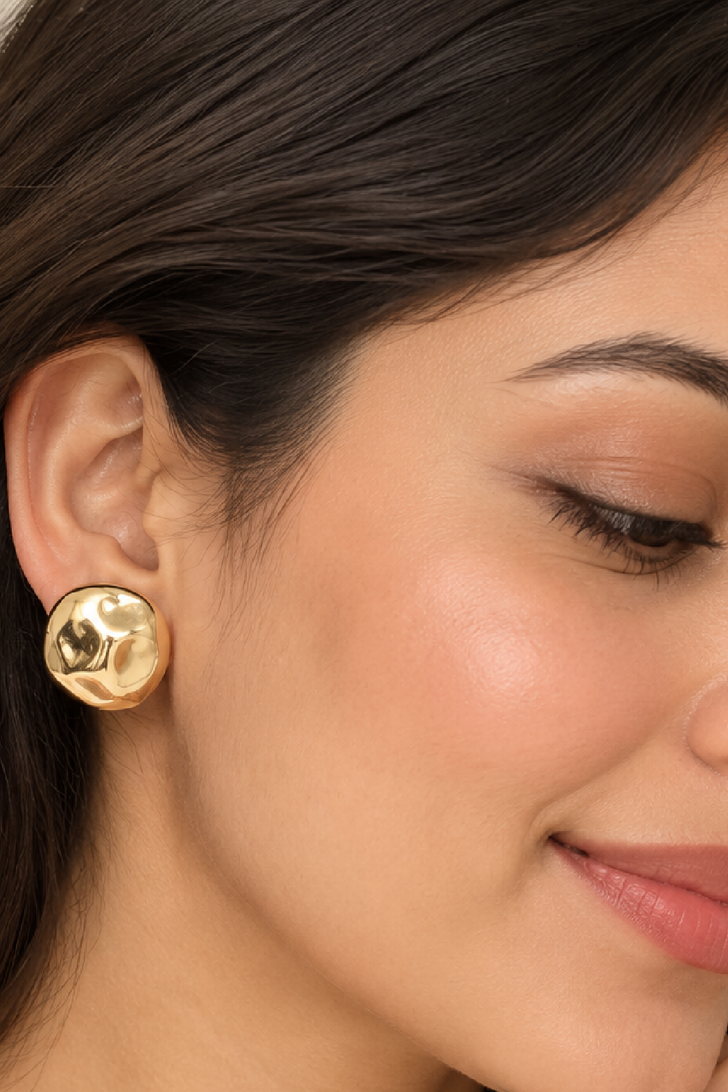 Gold plated sculpted round stud earrings with textured front