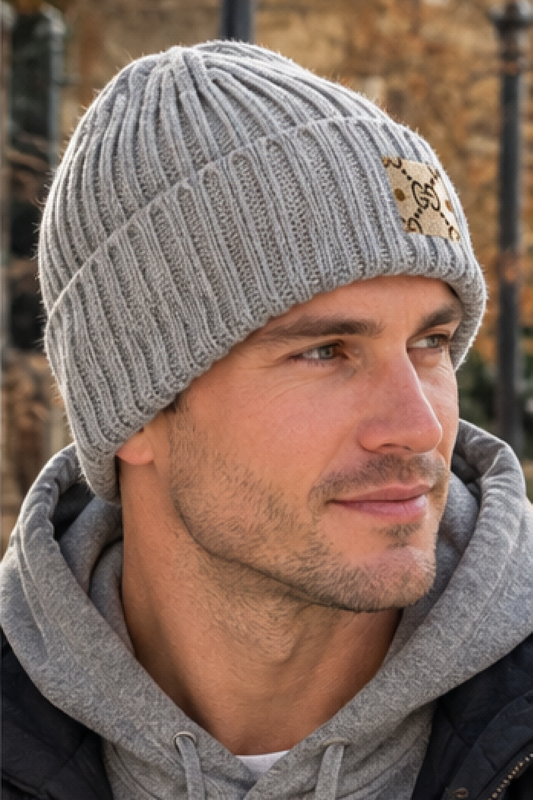 Upcycled Gucci beanie in gray ribbed knit with folded cuff and GG logo patch