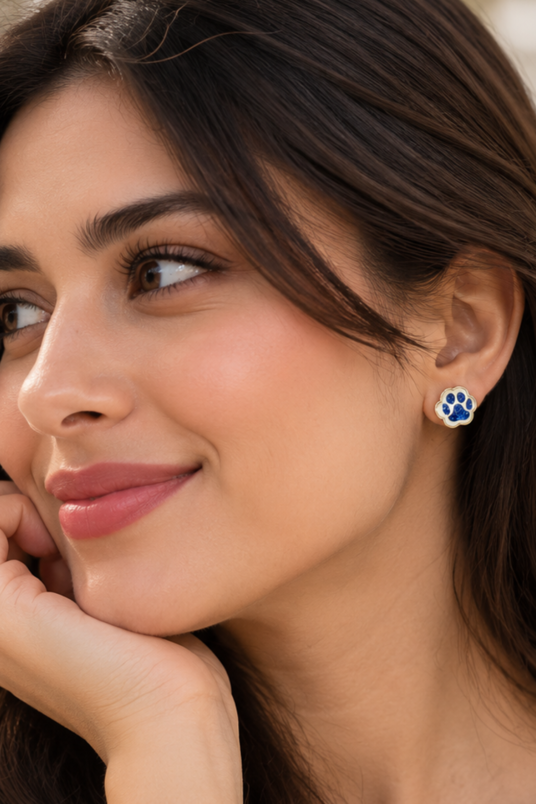 Blue paw print stud earrings with white border
