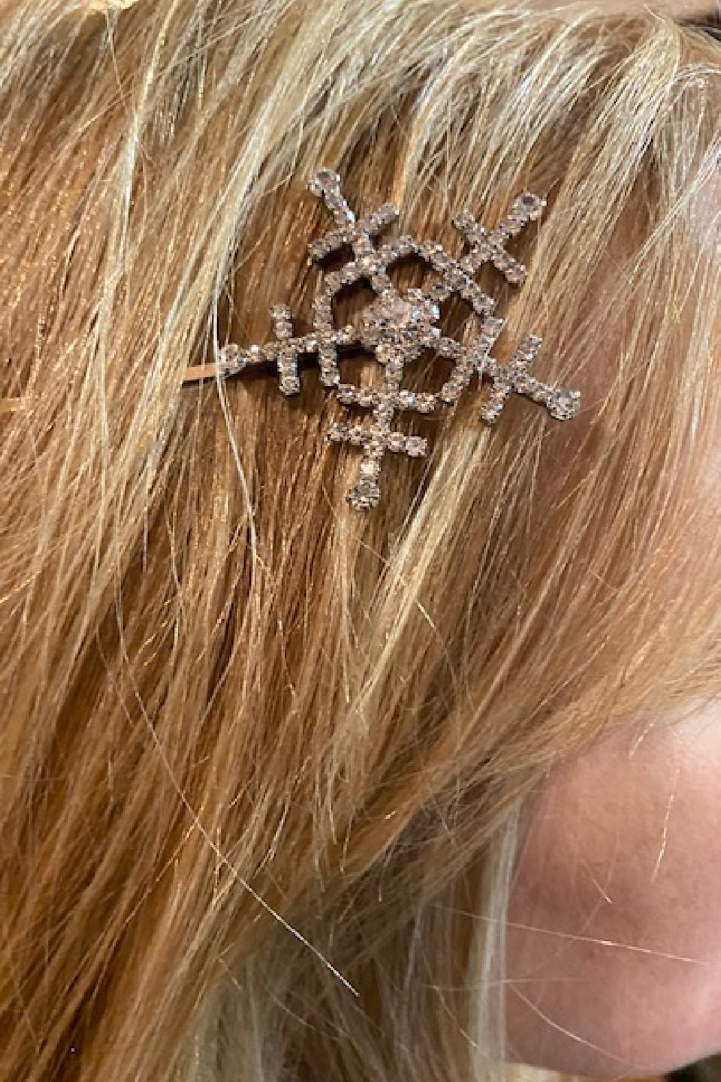 Snowflake hair pin worn on blonde hair, AB rhinestone snowflake design