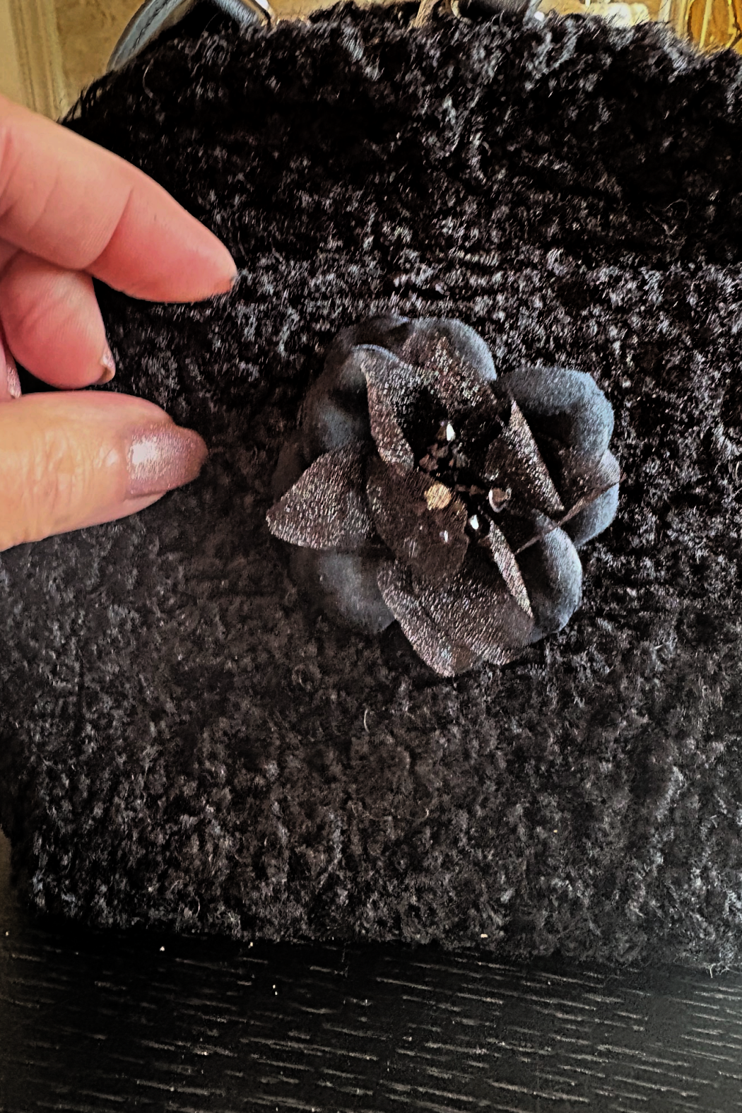 Black boucle handbag with fabric flower applique at front