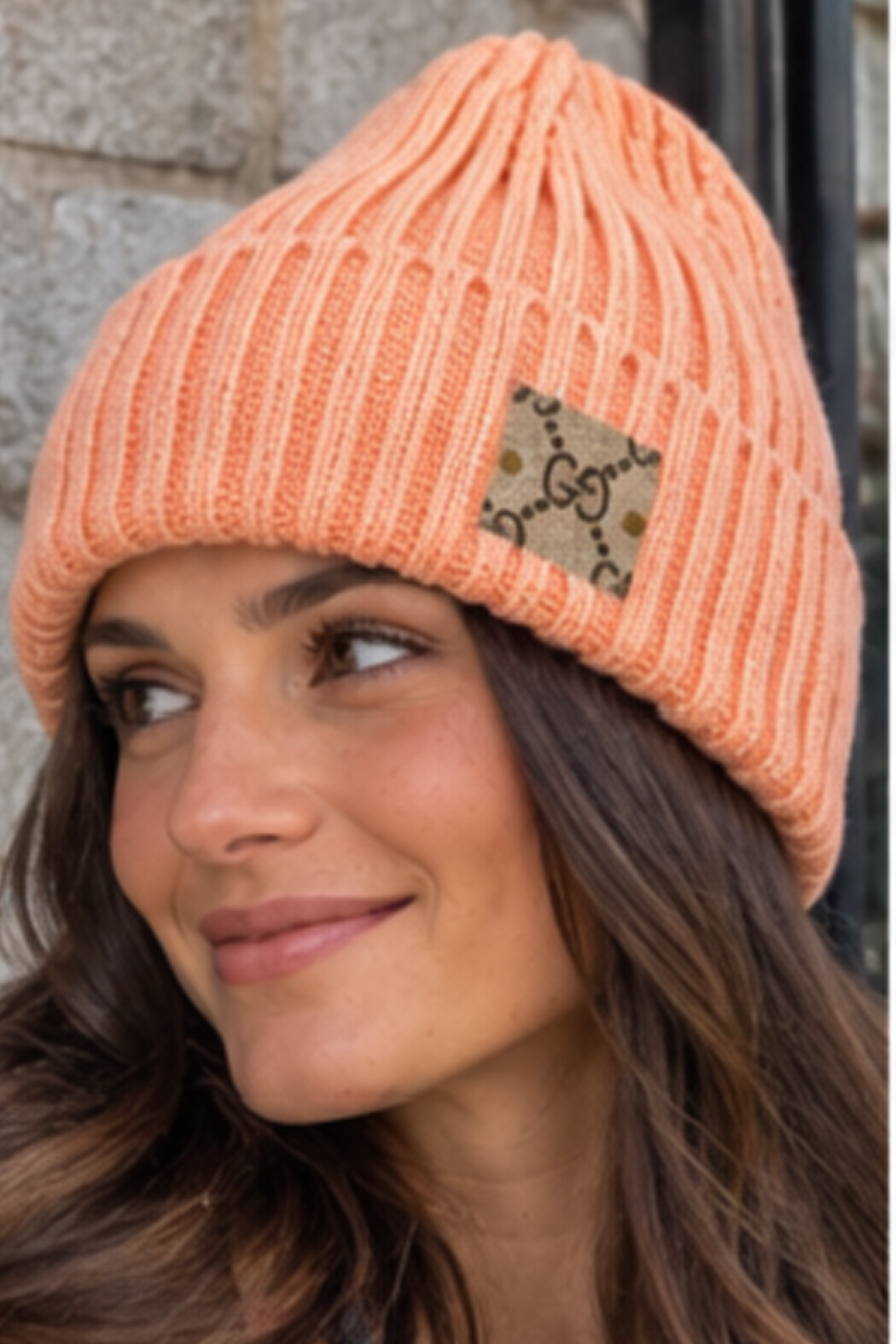 Upcycled Gucci beanie in peach ribbed knit with folded cuff and GG logo patch